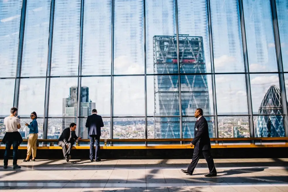 people in suits walking in building